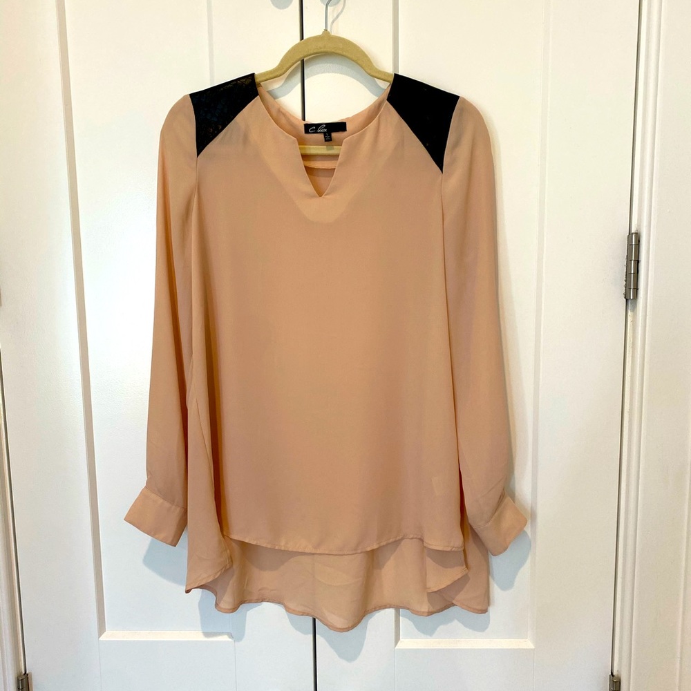 Tan long sleeve blouse with black leather shoulder detail size small.